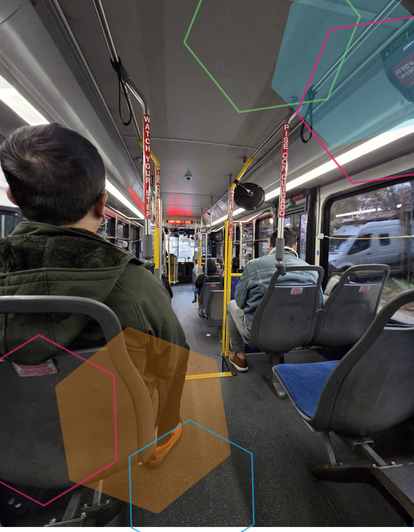 Inside bus with people sitting in seats with hexagon illustration overlay