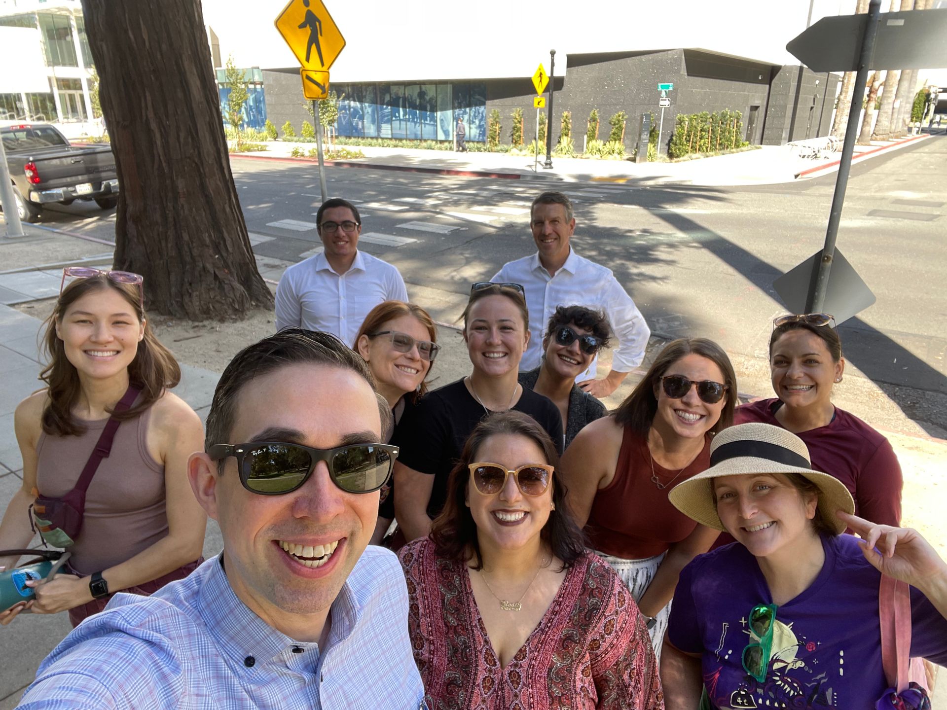 Group of people posing for selfie